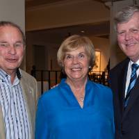 President Haas with two guests.